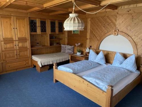 a bedroom with two beds in a room at Haus Elisabeth Schwaiger in Maria Alm am Steinernen Meer