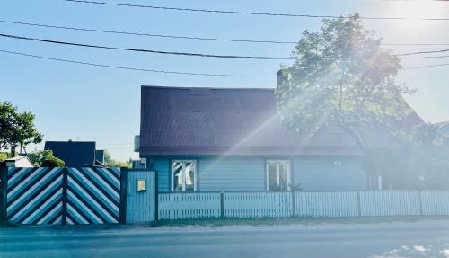 a blue house with a fence in front of it at Villa Blue Heaven Pärnu in Pärnu