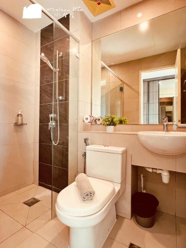 a bathroom with a toilet and a sink and a shower at Maison life 小居屋 The Loft Imago in Kota Kinabalu