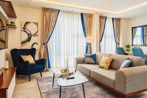 a living room with a couch and a table at Park Apartments in Accra