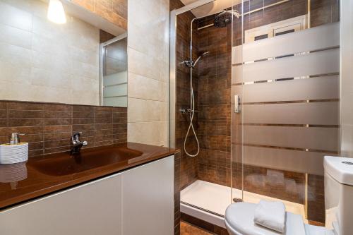 a bathroom with a sink and a shower at Malaga Center Flat Soho Modern 2BR in Málaga