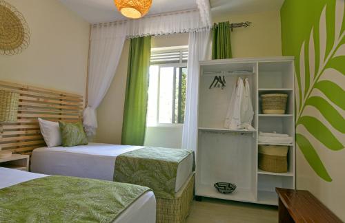 Una cama o camas en una habitación de Residence 256 Kampala, Kigo