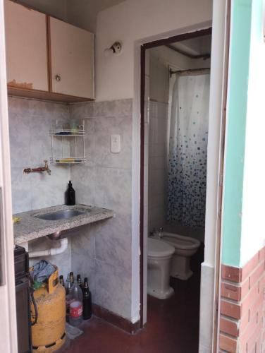 a bathroom with a sink and a toilet at Lo de Su in Salta