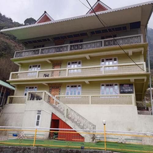 a building with a staircase in front of it at Rufina Lachung de'CROWN in Lachung