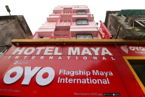 a hotel maya international sign on the side of a building at Hotel O Home Cozy Studio Collage Square Hotel Maya International Near St. Thomas's Church in Kolkata