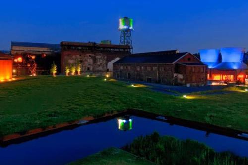 a view of a building with a water tower at night at Im Herzen von Bochum in Bochum