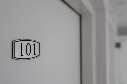 a door with a clock on the side of it at Hotel Hayat in Sarajevo