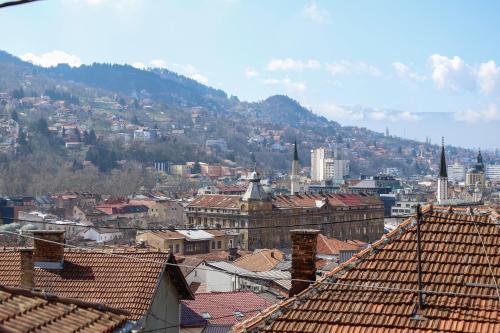 a view of a city with roofs of buildings at Hotel Hayat in Sarajevo