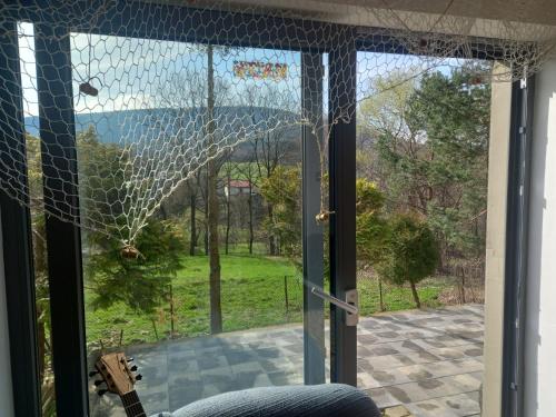 a screened in porch with a view of a yard at U Roberta in Czaniec