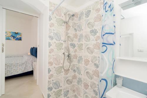 a bathroom with a shower with a shower curtain at Casa Anna Nerano in Nerano