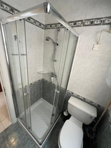 a bathroom with a shower and a toilet at Location Location Location in Sliema