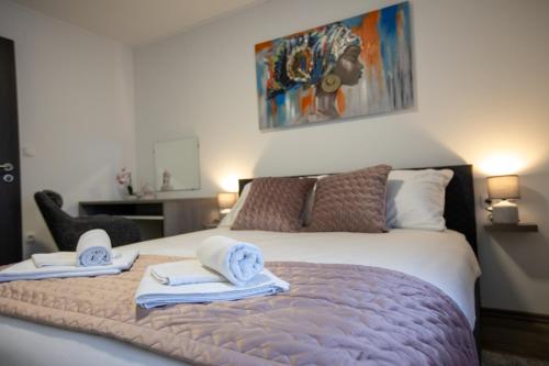 Postel nebo postele na pokoji v ubytování APARTMANI TEA