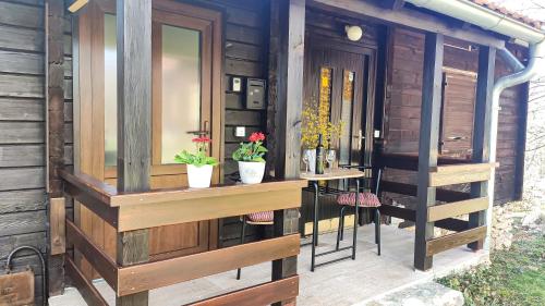a small house with a counter and a table at Plitvice Glock Apartment in Plitvička Jezera