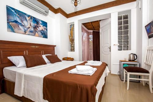 Postel nebo postele na pokoji v ubytování MERVE BUTİK OTEL