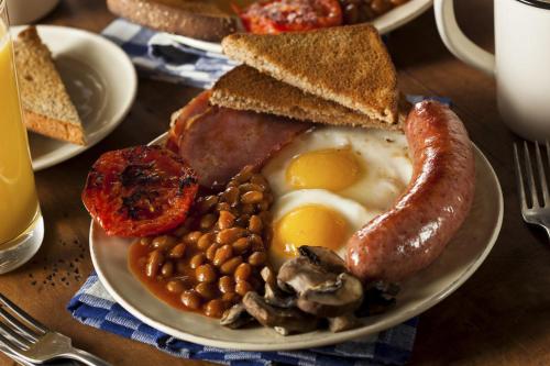 a plate of breakfast food with eggs beans and toast at ALBERGO DEL PESCATORE in Minamiaizu