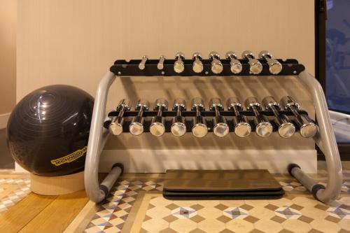 a helmet is sitting next to an electronic device at Alexandra Barcelona Hotel, Curio Collection by Hilton in Barcelona
