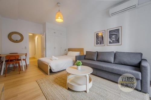 a living room with a couch and a table at Comodo y centrico Loft en calle Carretas - Madrid Centro in Madrid