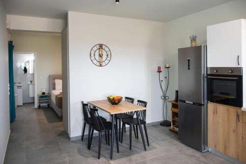 a kitchen and dining room with a table and chairs at Kolymvari Hills in Chania Town