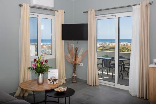 a living room with a view of the ocean at Kolymvari Hills in Chania Town