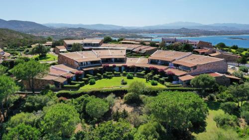 an aerial view of a campus with a building at Capo Ceraso Family Resort in Costa Corallina