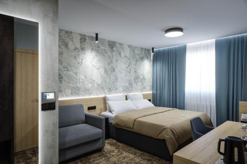 En eller flere senge i et værelse på Hotel Senec Aqua Resort