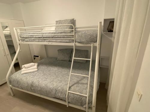 a couple of bunk beds in a room at Kilimin in Pamplona