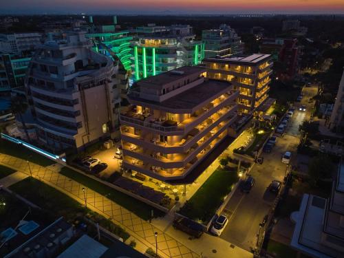 an overhead view of a city at night at Bellettini Hotel in Milano Marittima