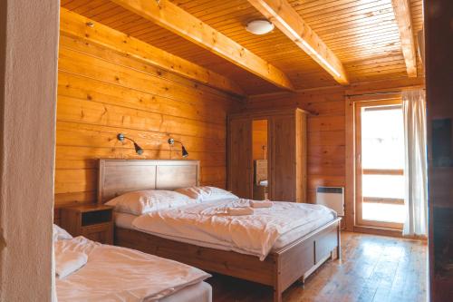 Postel nebo postele na pokoji v ubytování SKI CIERNY BALOG