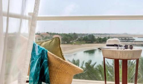 a room with a window with a view of the water at Al Raha Beach Hotel - Superior Room SGL - UAE in Abu Dhabi