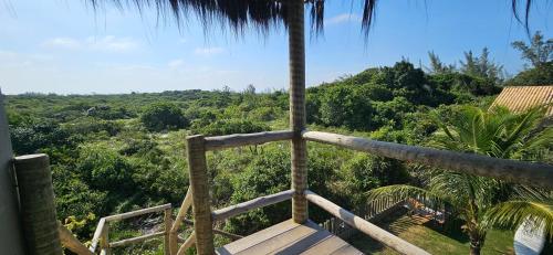 a room with a view of a forest at Kite Nômade in Arraial do Cabo