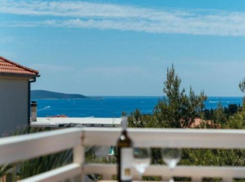 a view of the ocean from a balcony at Apartments Trogrlić in Hvar