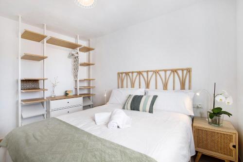 Ένα ή περισσότερα κρεβάτια σε δωμάτιο στο Apartamento Joya la Carihuela