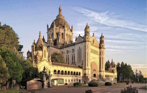a large building with a tower on top of it at Stunning Home In Stmarguerite Dloges in Sainte-Marguerite-des-Loges