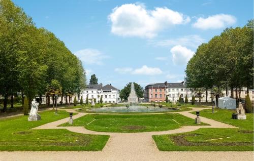 a view of a park with a fountain and buildings at Stunning Home In Stmarguerite Dloges in Sainte-Marguerite-des-Loges