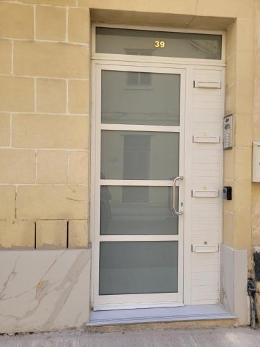 a door with the number on it at Full Sun Getaway APT Sliema - 1BR in Sliema
