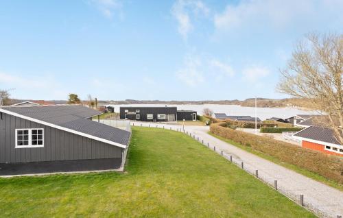 a view of a black house with a green lawn at Nice Home In Haderslev With Wifi in Haderslev