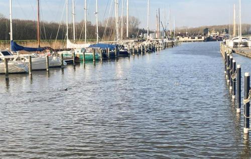 a group of boats docked at a dock in the water at 3 Bedroom Amazing Home In Wieringerwerf in Wieringerwerf