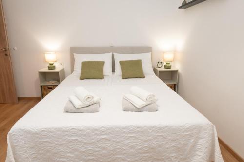 Postel nebo postele na pokoji v ubytování Apartments Basic
