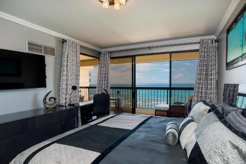 a living room with a view of the ocean at Waikiki Beach Tower in Honolulu