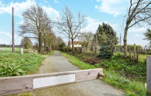 a wooden bridge over a dirt road at Gorgeous Home In Passais-Villages in Saint-Siméon