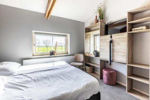 Una cama o camas en una habitación de Weeruusz