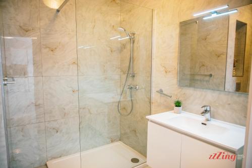 a bathroom with a shower and a sink at Mensija Valley Residences in St Julian's