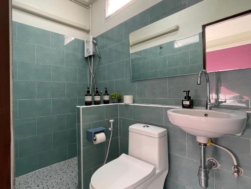 a bathroom with a white toilet and a sink at Self check-in apartment by Baiput Hometel in Phra Nakhon Si Ayutthaya