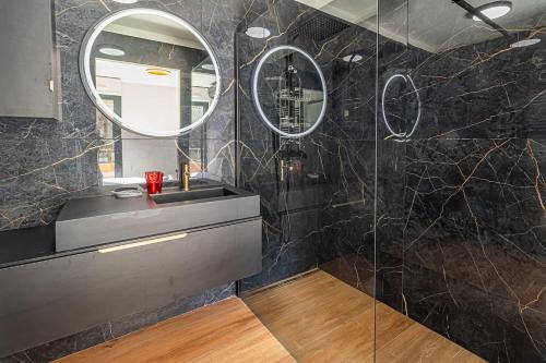 a bathroom with a sink and a mirror at Beautiful Apartment With Terrace Around Monaco in Beausoleil