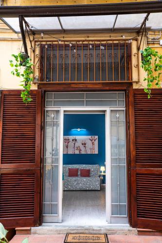 an entrance to a building with a couch in it at Napoli Centro Casa Vacanza in Naples