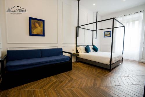 a living room with a bed and a couch at Palazzo dei Conti in Naples
