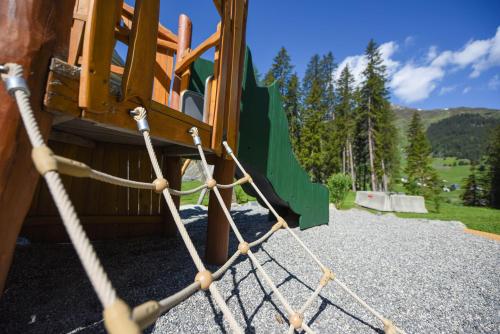 a rope tied to a slide in a playground at AlpenGold Hotel Davos in Davos