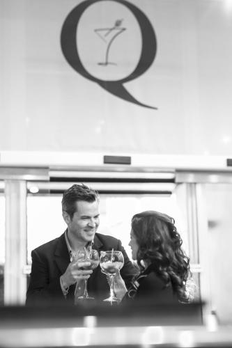a man and a woman holding glasses of wine at The Queens Gate Hotel in London