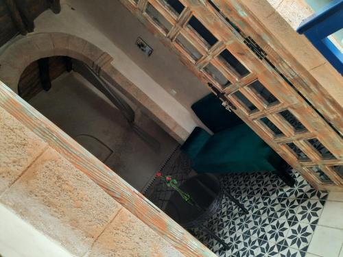 an overhead view of a room with a table and a floor at Dar Halima in Essaouira