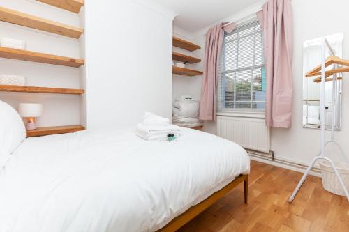 Кровать или кровати в номере GuestReady - Uma joia escondida em Brighton